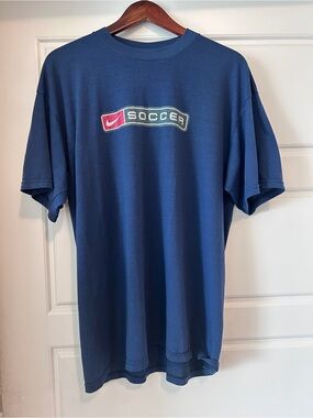 Nike Blue Soccer Logo T-Shirt with Red Accent